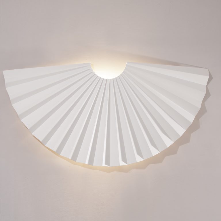 This is the Jeux Wall light designed by jacobsroom studio, Rome. Super light origami folded wall decor made by hand in Italy